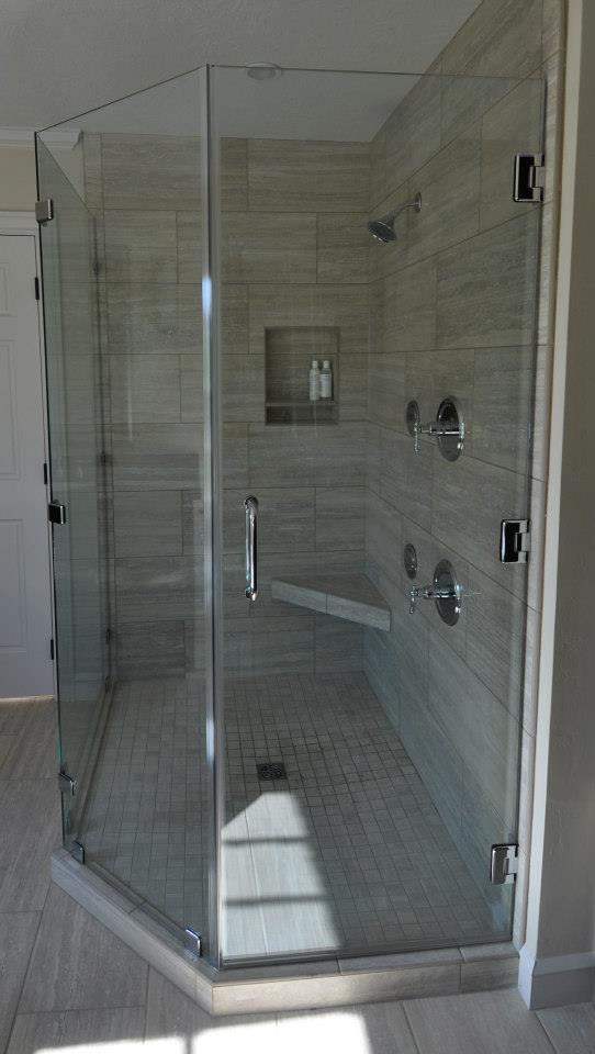 The Suffolk - an historic, remodeled home has a new frameless shower using 3/8" ShowerGuard® Tempered Safety Glass set at a neo angle with Chrome finished hardware. This is a beautiful master bath.